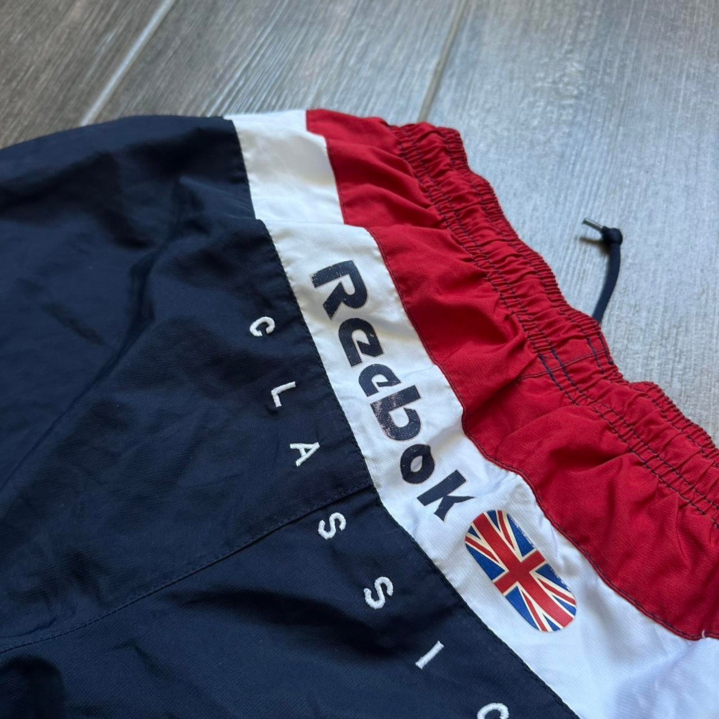 Reebok navy blue shorts with red accents