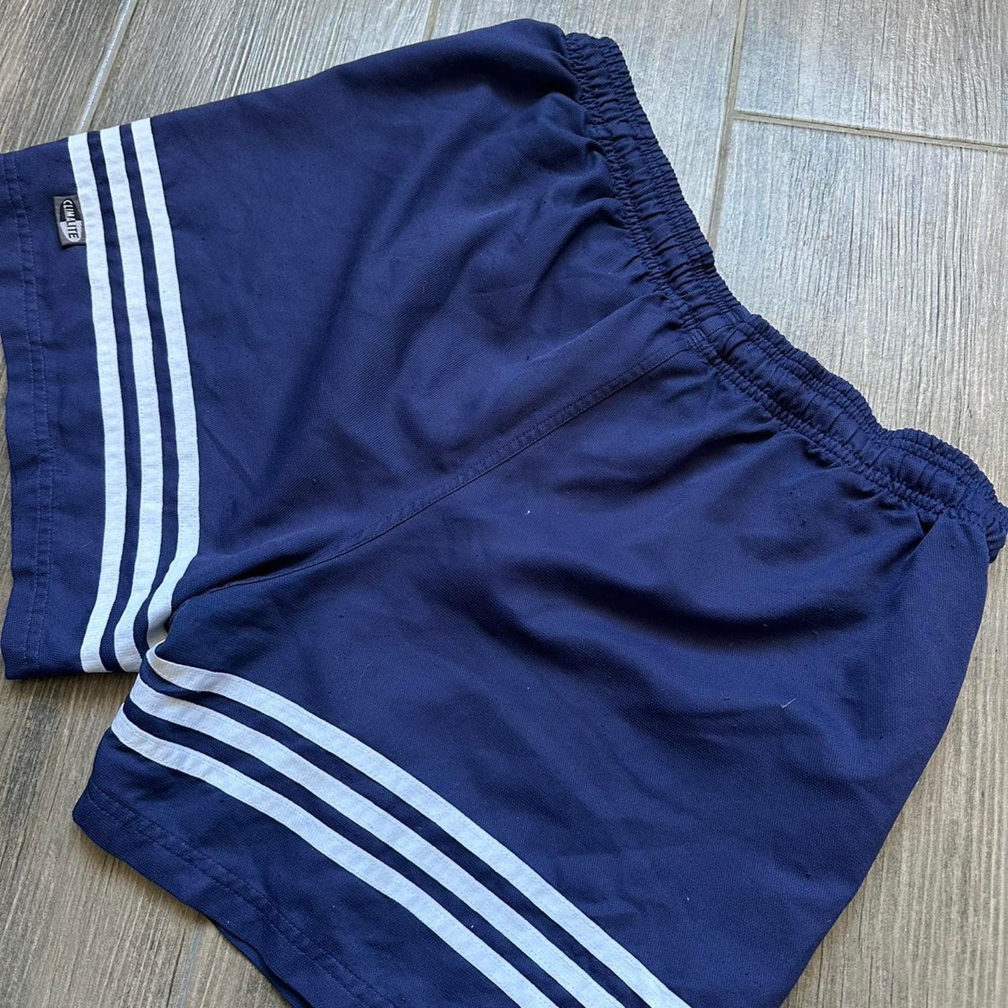 Adidas navy blue shorts with white stripes
