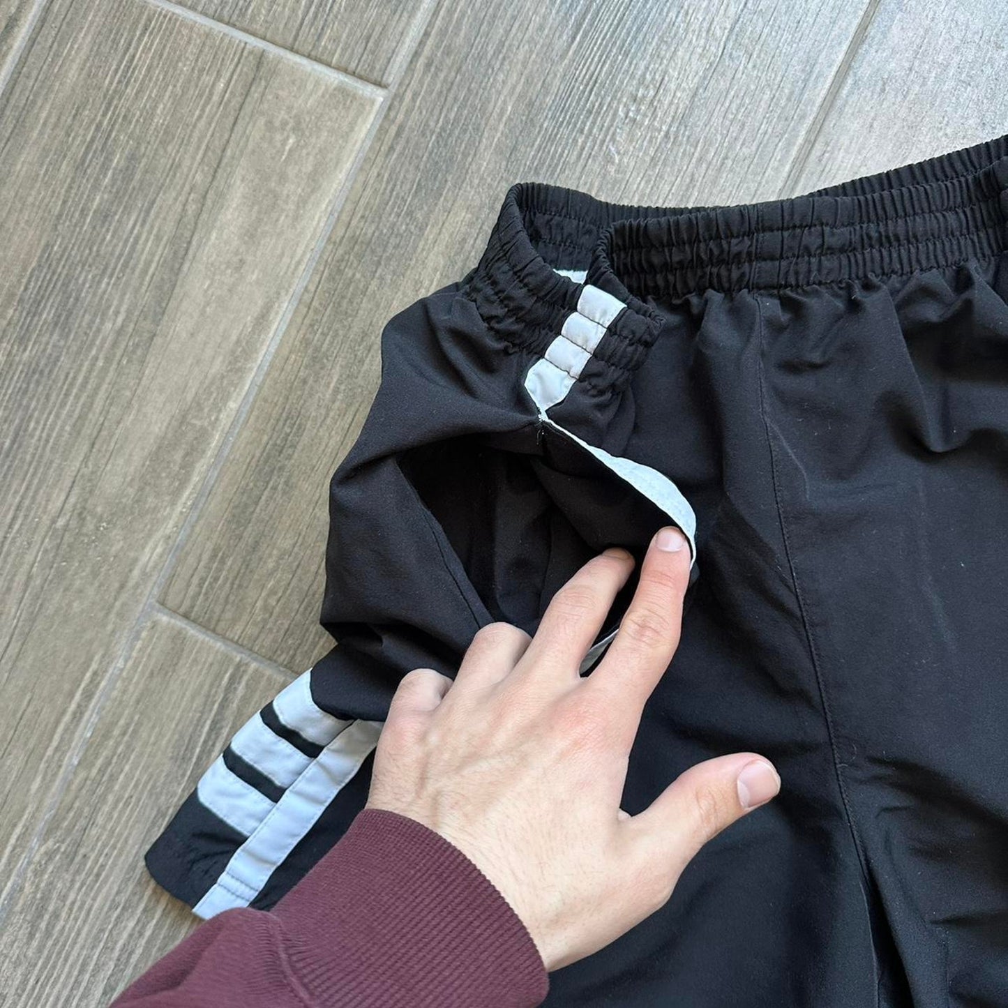 Adidas black shorts with white stripes