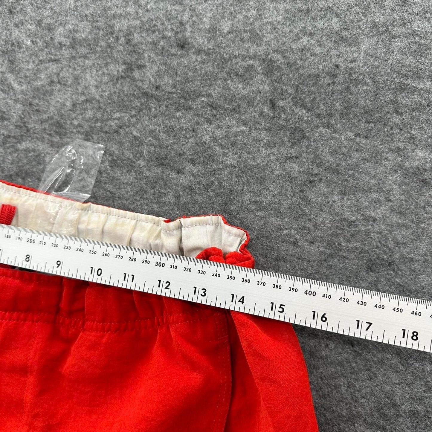 Nike red shorts with white