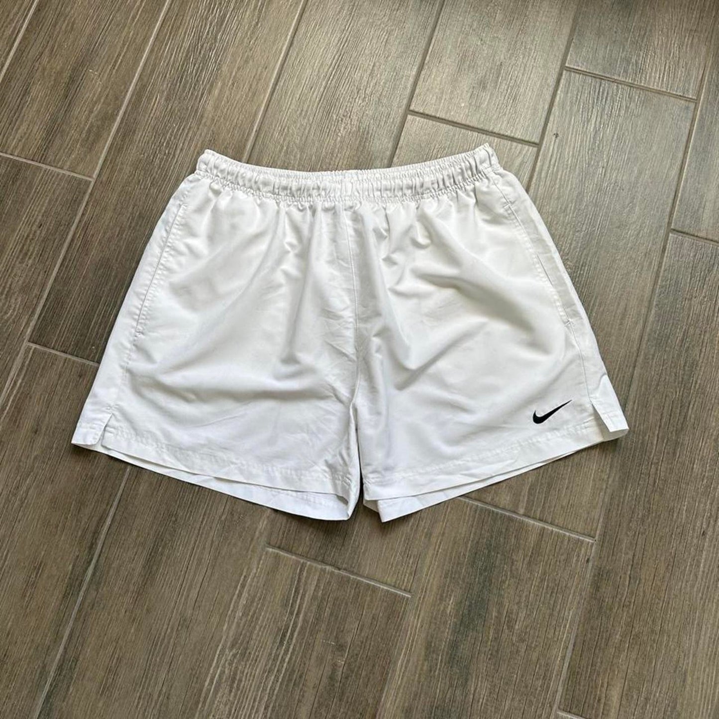 Nike white shorts with black swoosh