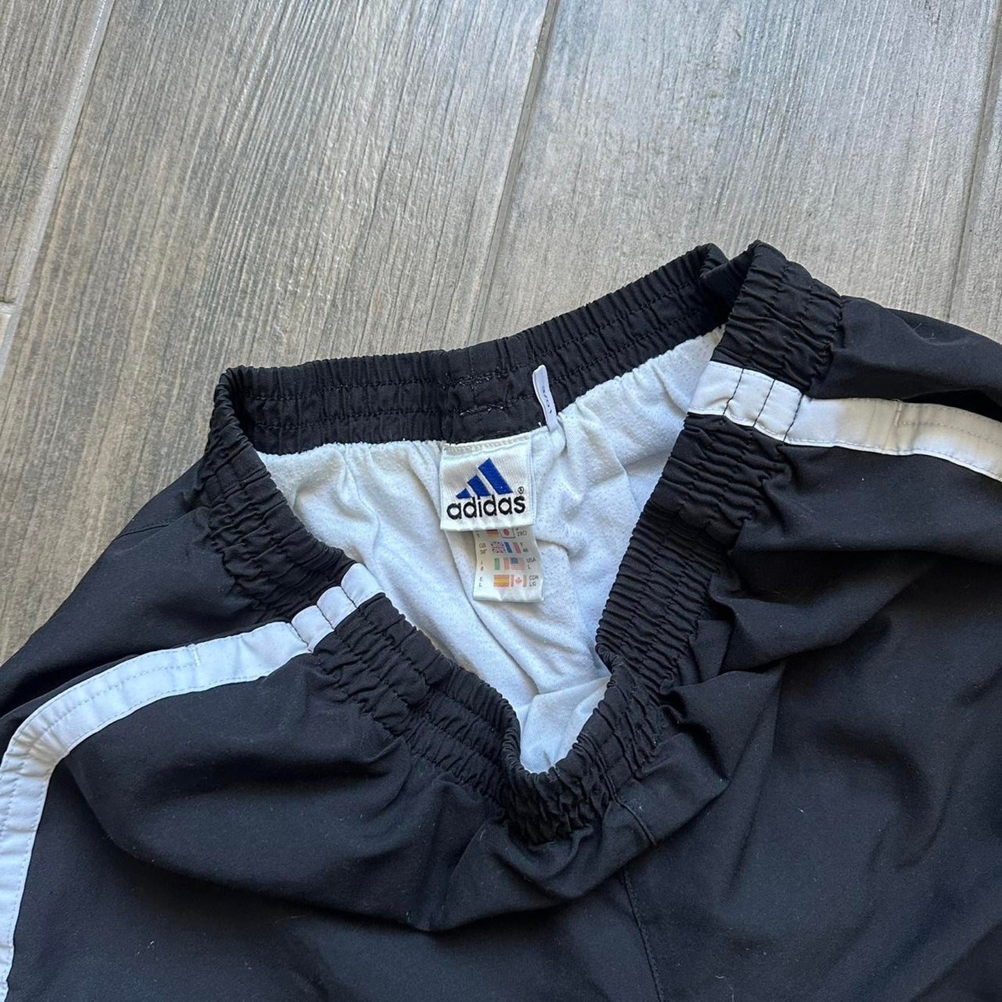 Adidas black shorts with white stripes