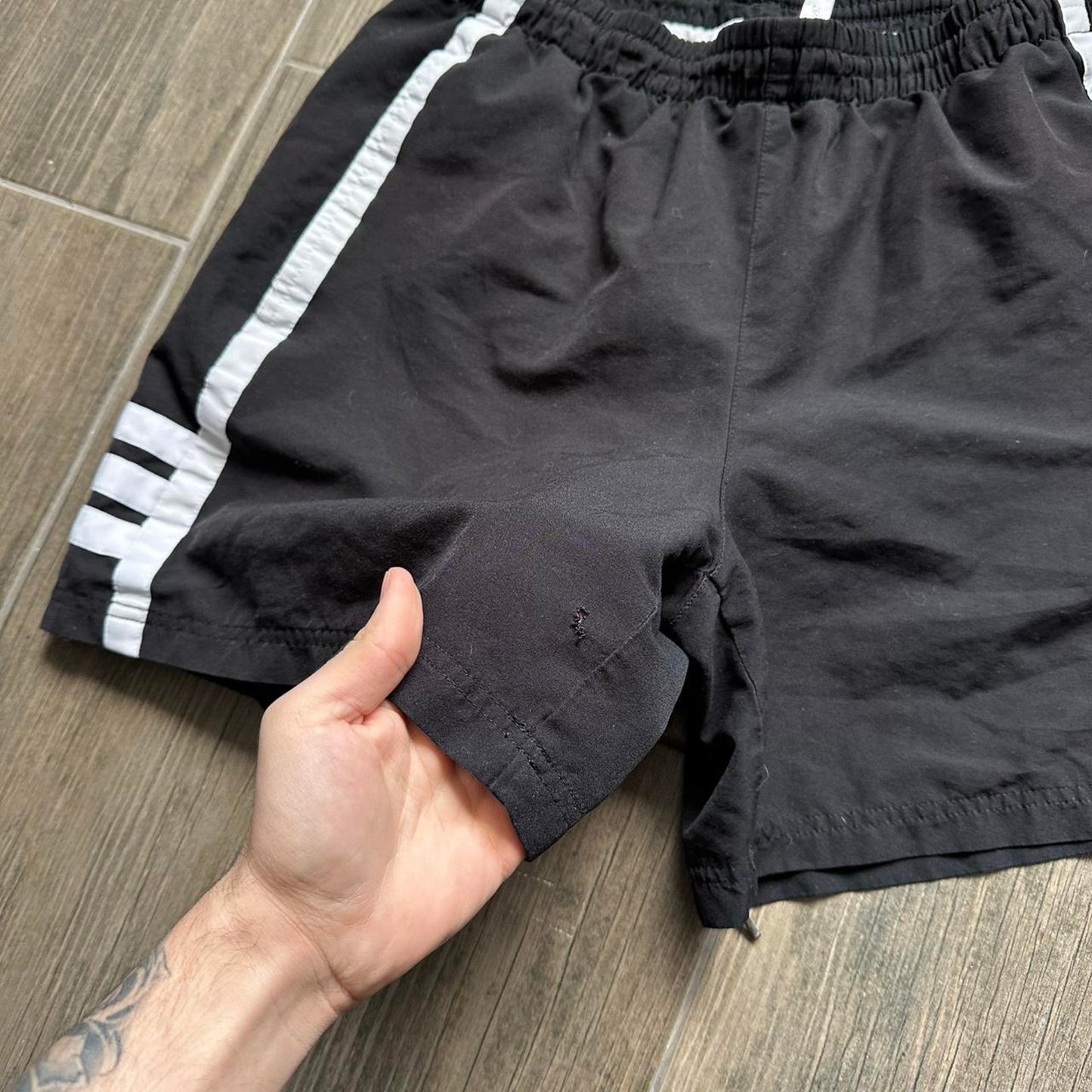 Adidas black shorts with white stripes