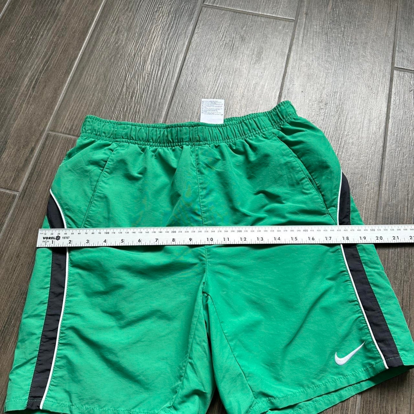 Nike green shorts with white and black stripes