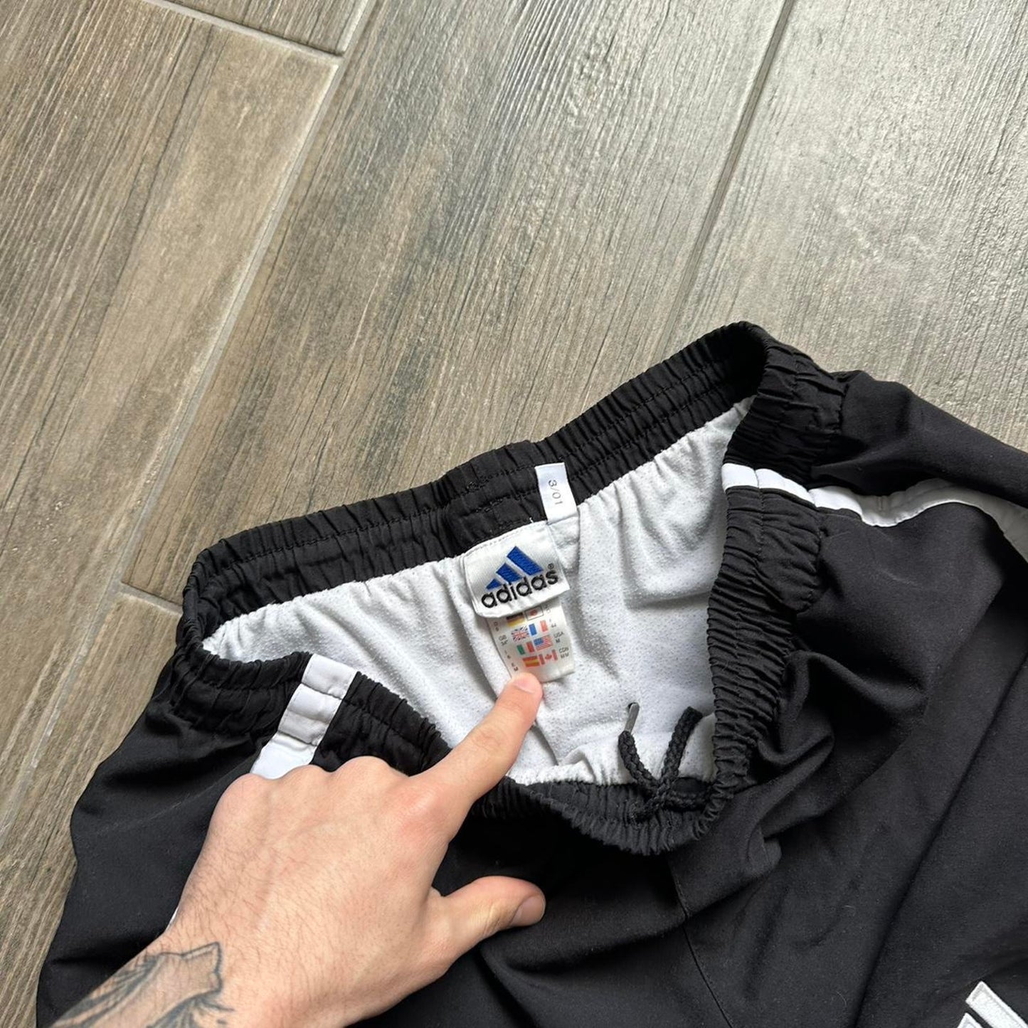 Adidas black shorts with white stripes