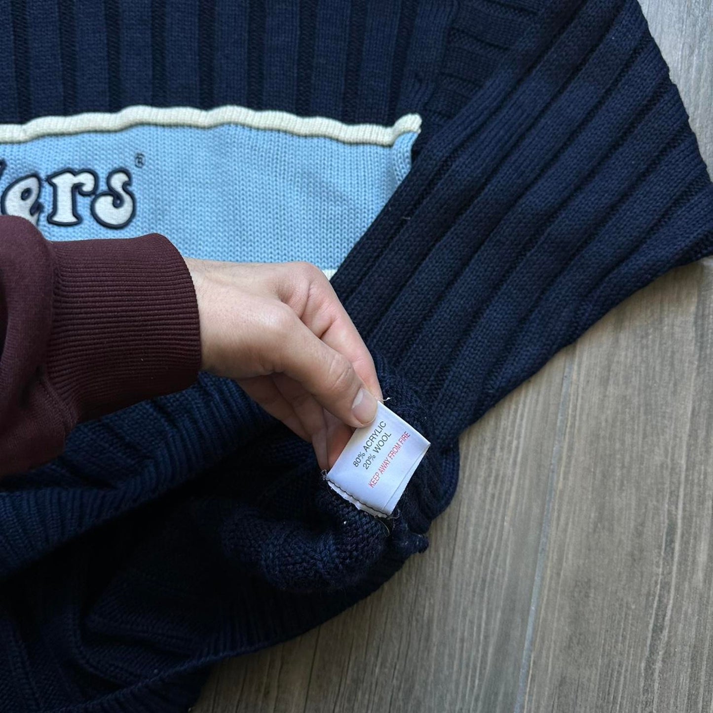 Kickers navy blue sweater with white and light blue accents