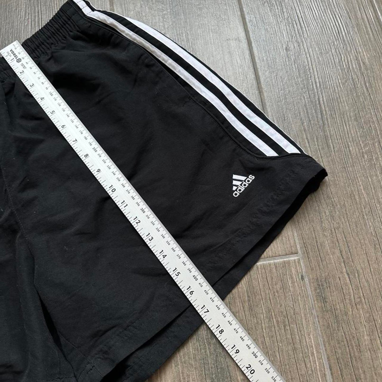 Adidas black shorts with white stripes