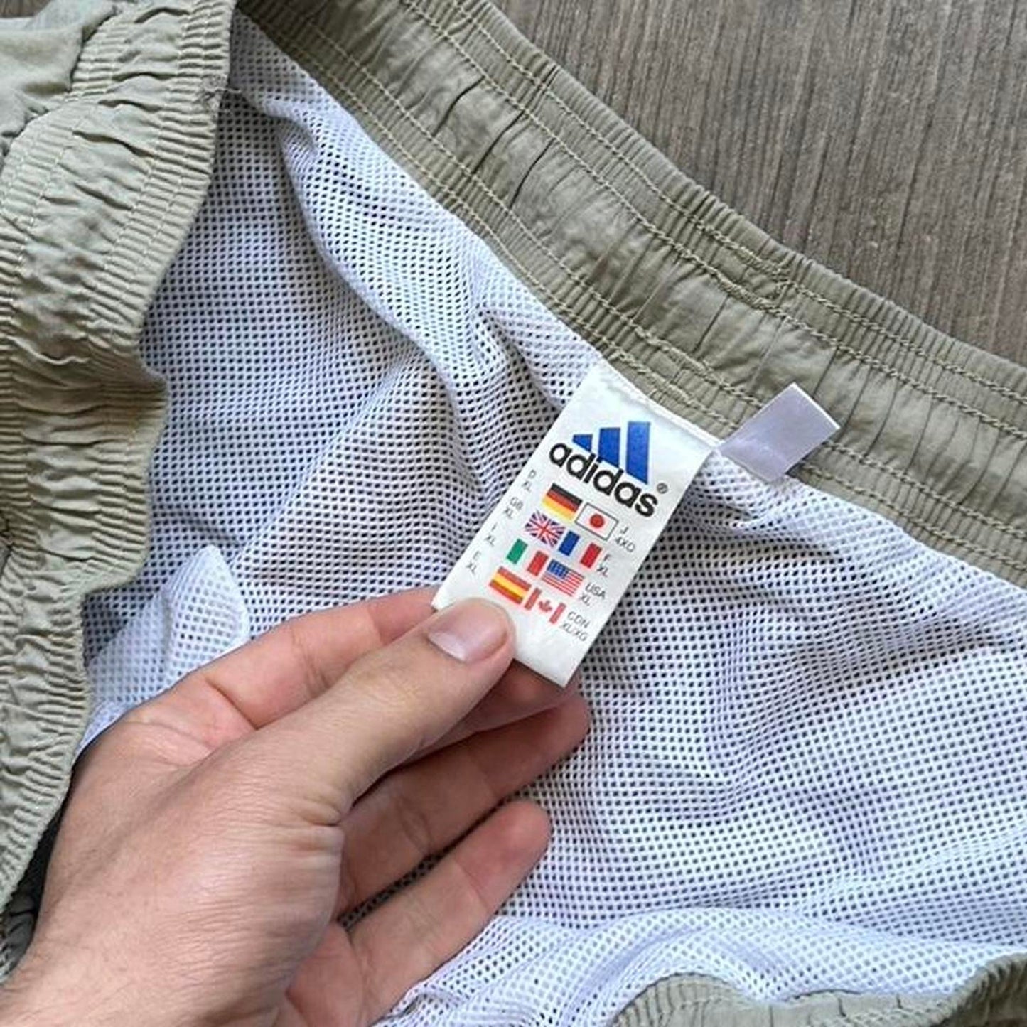 Adidas khaki shorts with drawstring waist and pockets