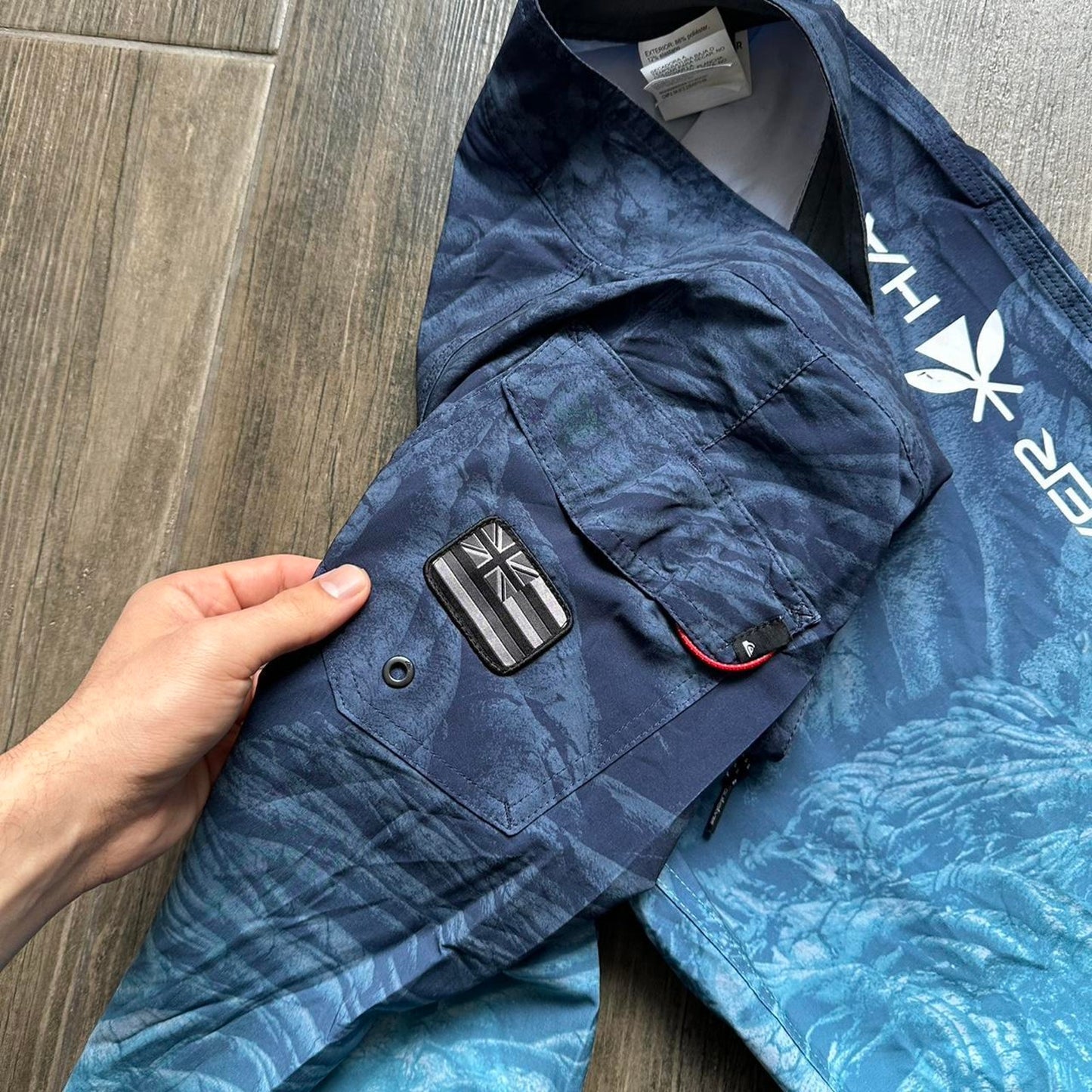 Quiksilver blue board shorts with palm tree design