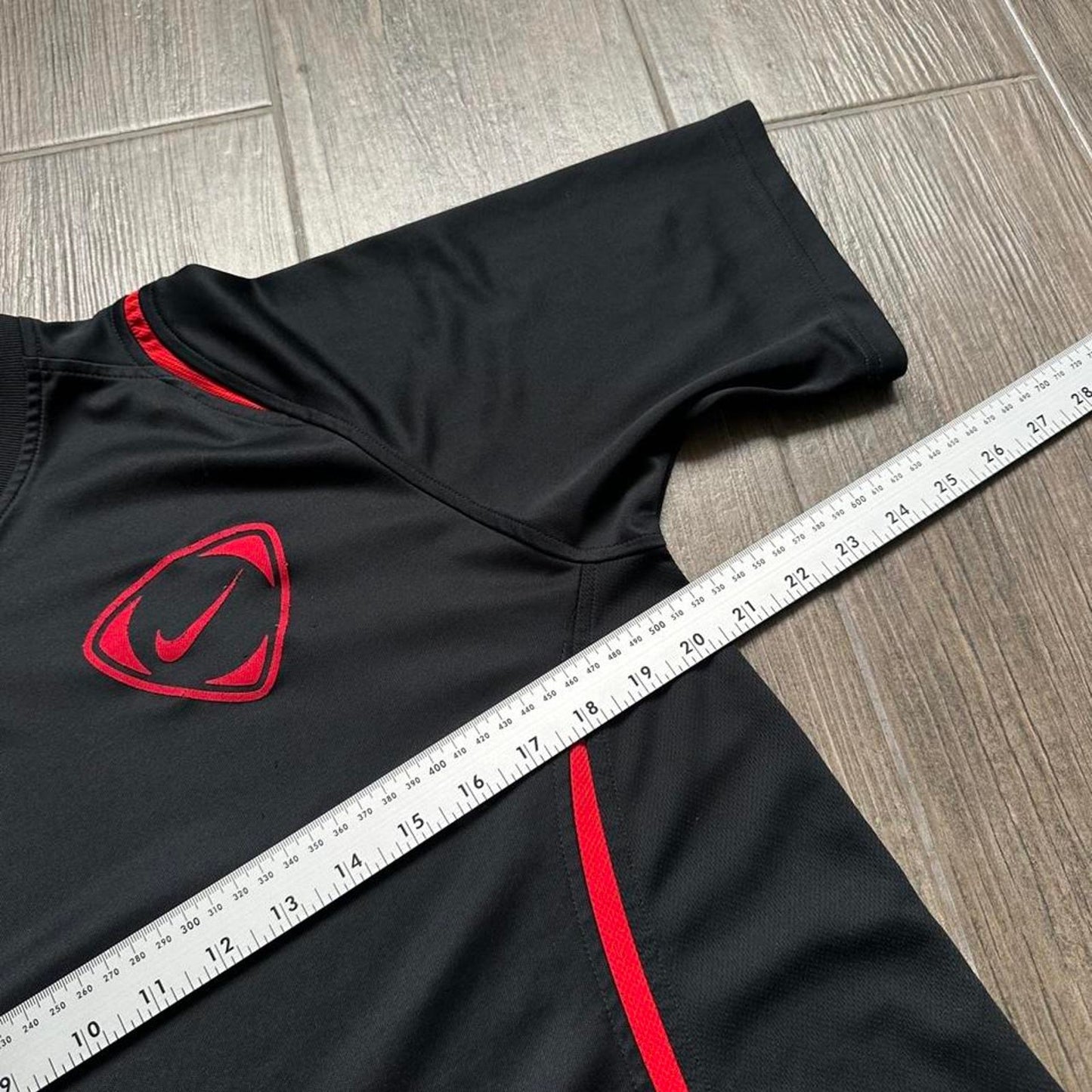 Nike black and red soccer jersey