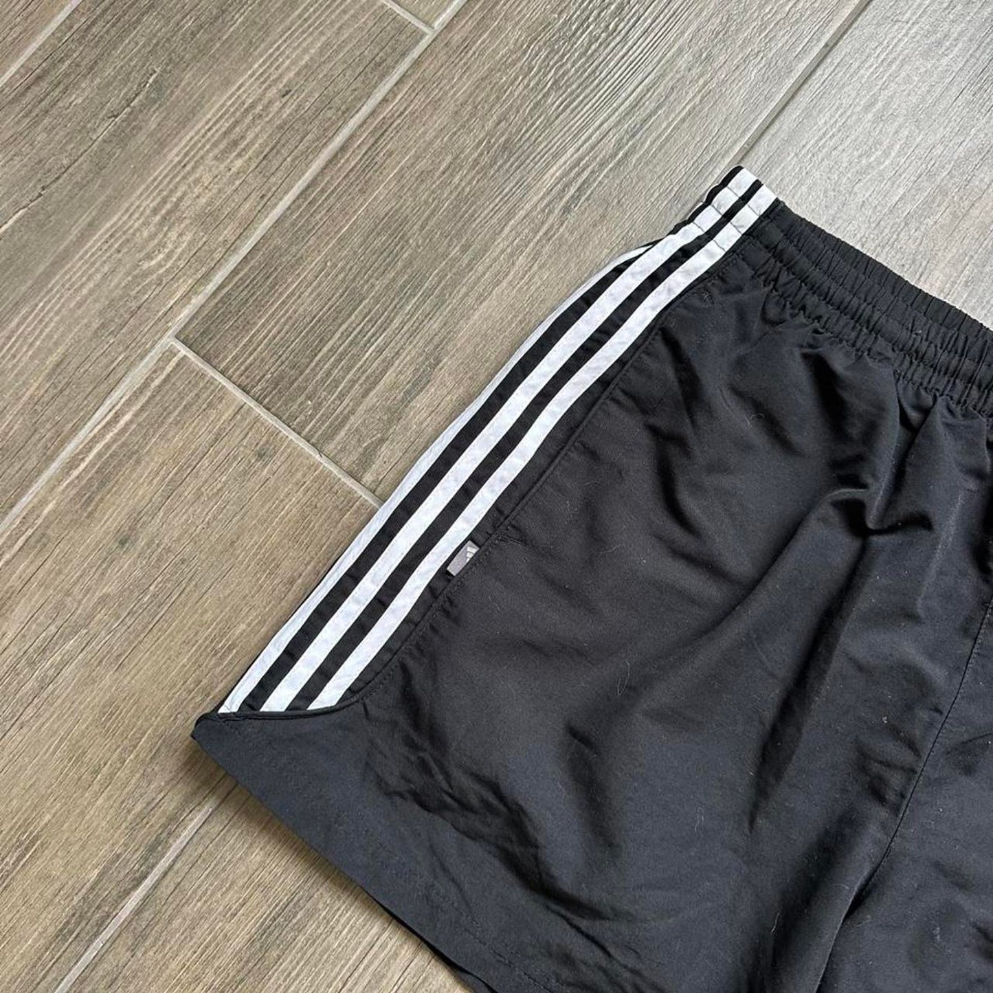 Adidas black shorts with white stripes