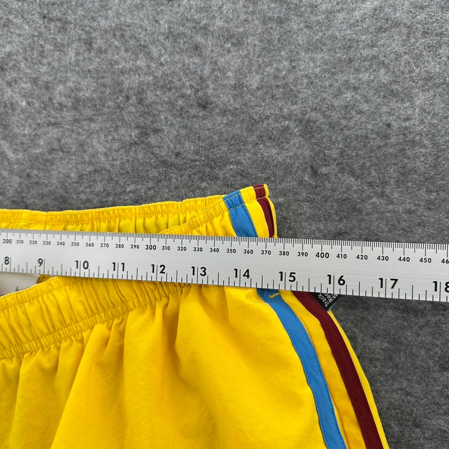 Nike yellow track shorts