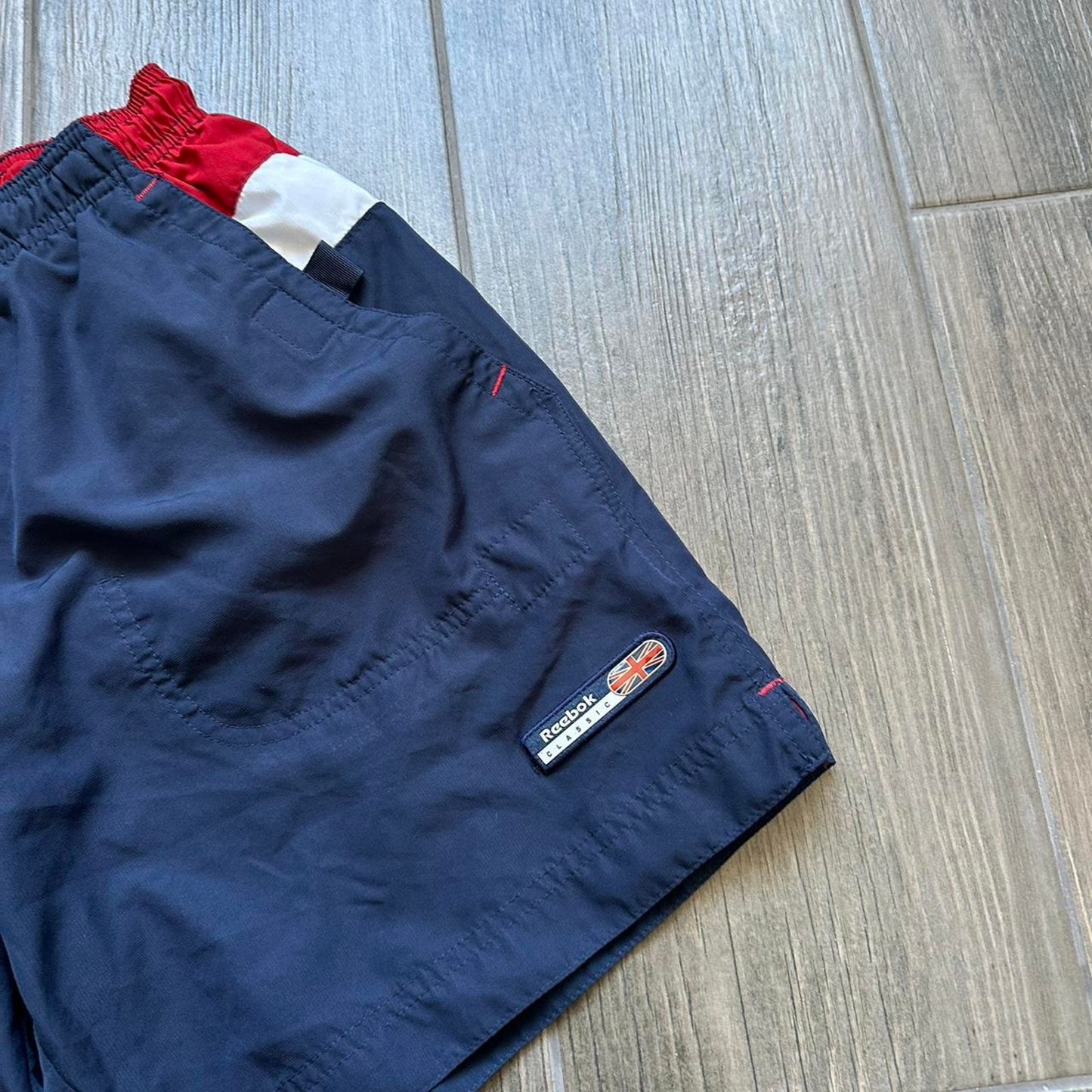 Reebok navy blue shorts with red accents