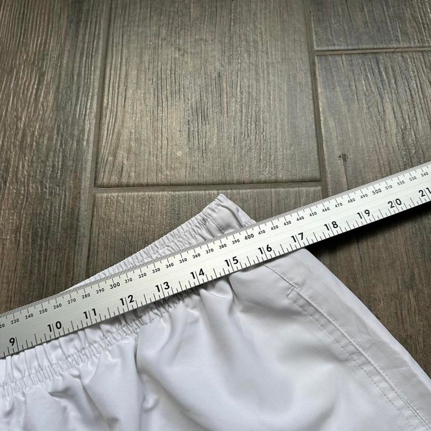 Nike white shorts with black swoosh