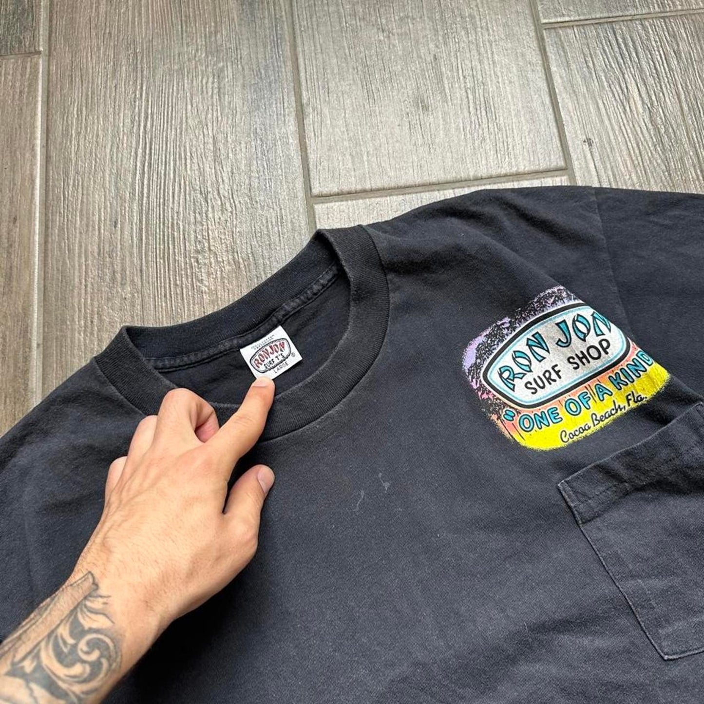 Ron Jon Surf Shop black t-shirt with colorful graphic