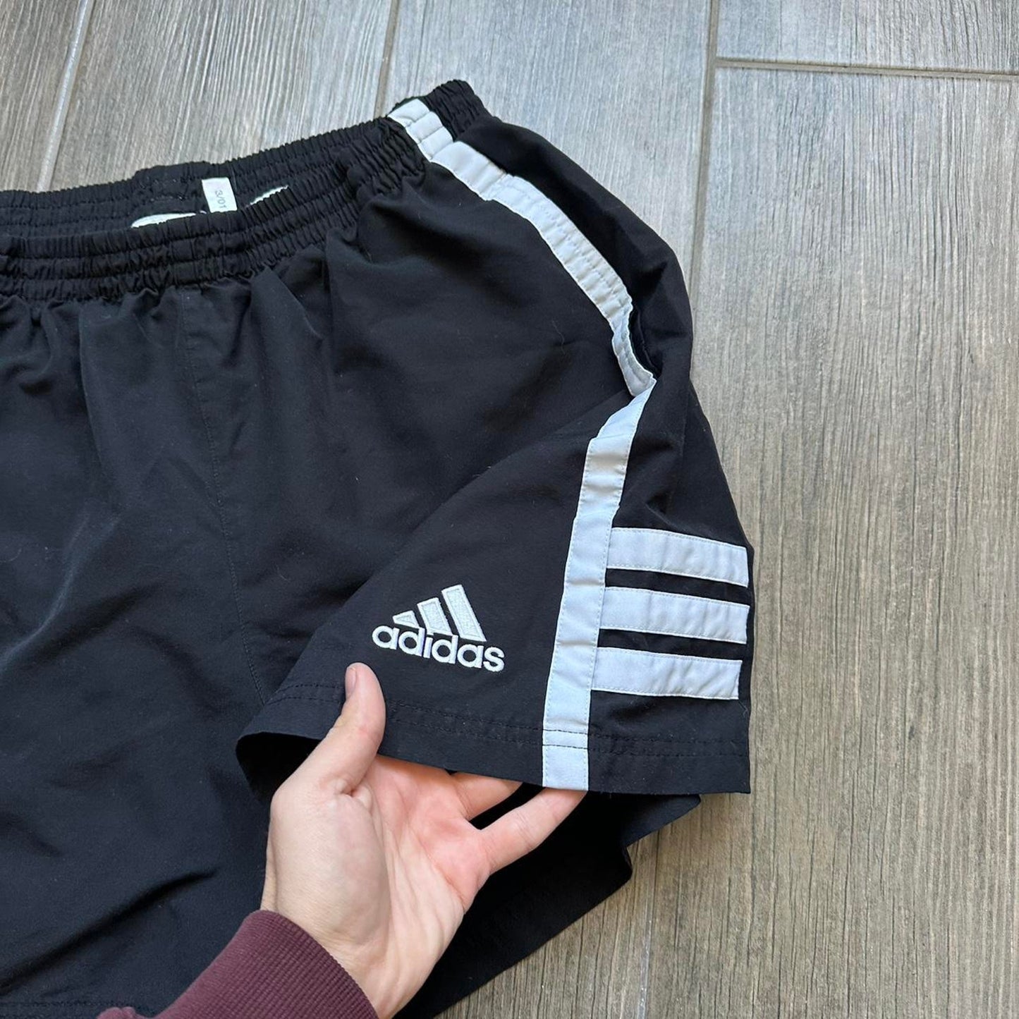 Adidas black shorts with white stripes