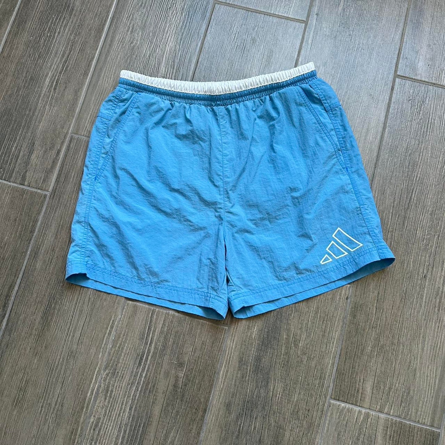 Adidas blue shorts with white