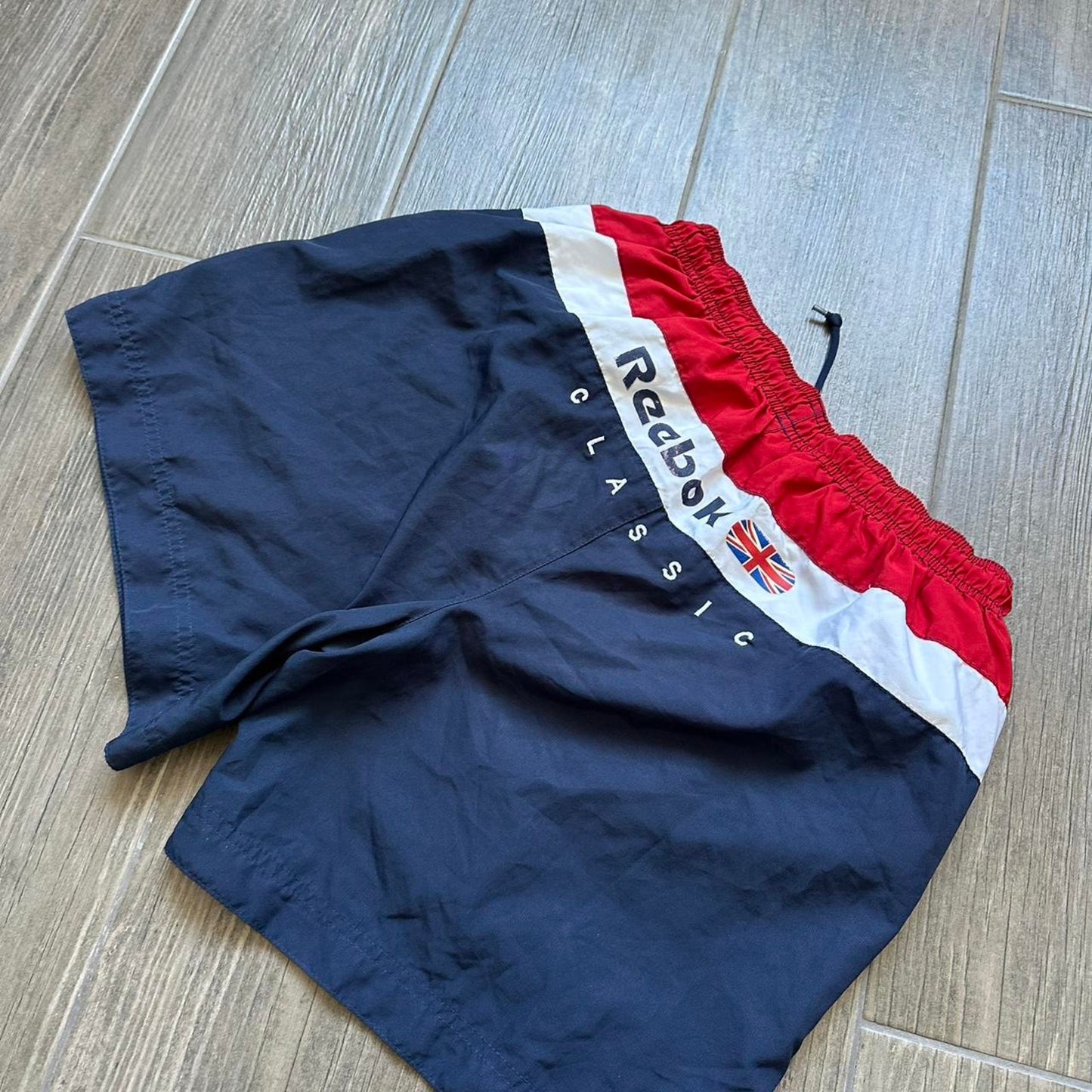 Reebok navy blue shorts with red accents
