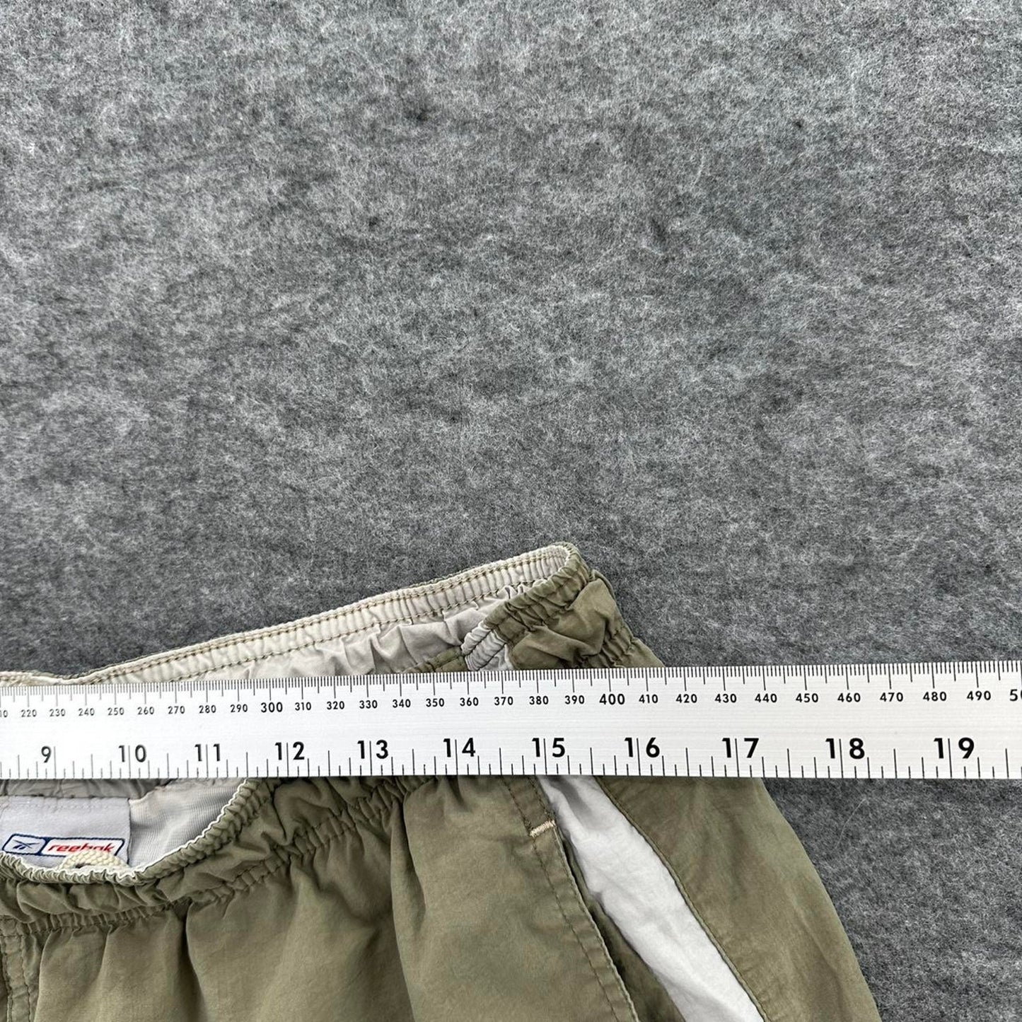 Reebok khaki shorts with white