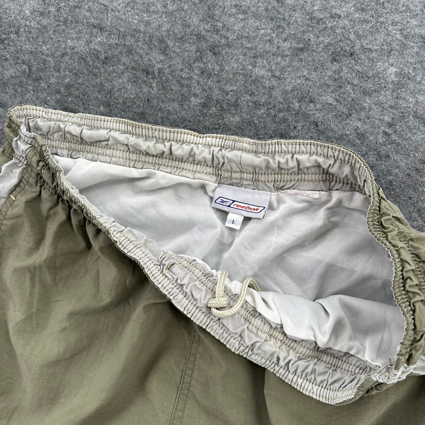 Reebok khaki shorts with white