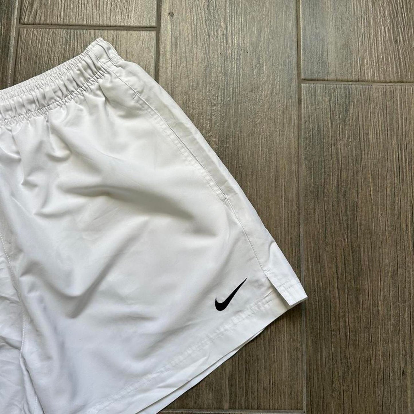 Nike white shorts with black swoosh