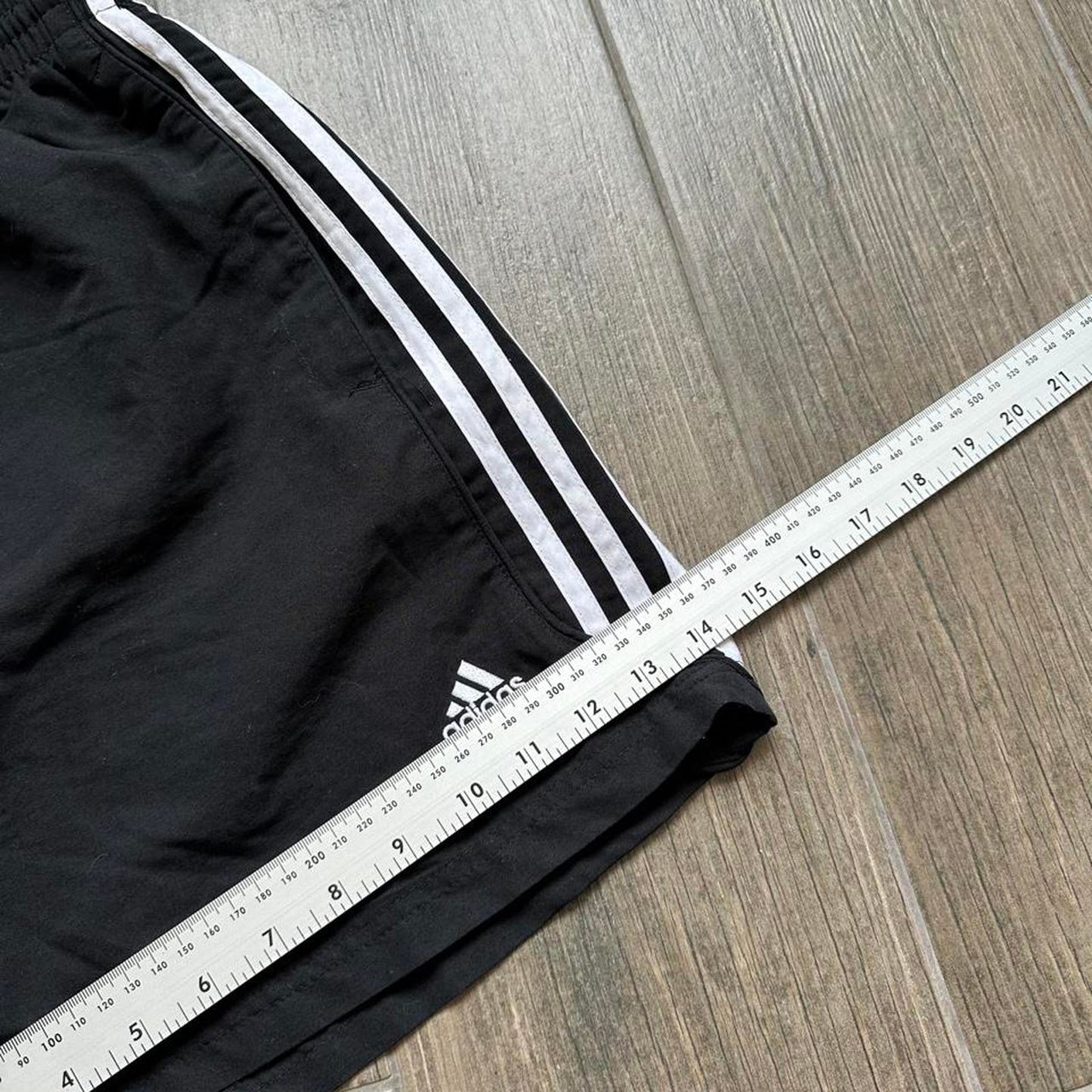 Adidas black shorts with white stripes