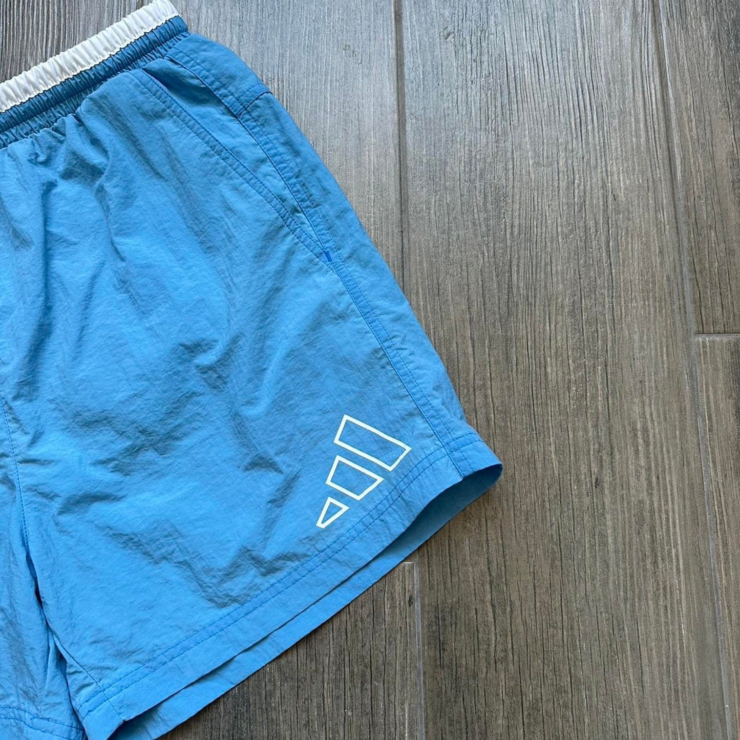 Adidas blue shorts with white
