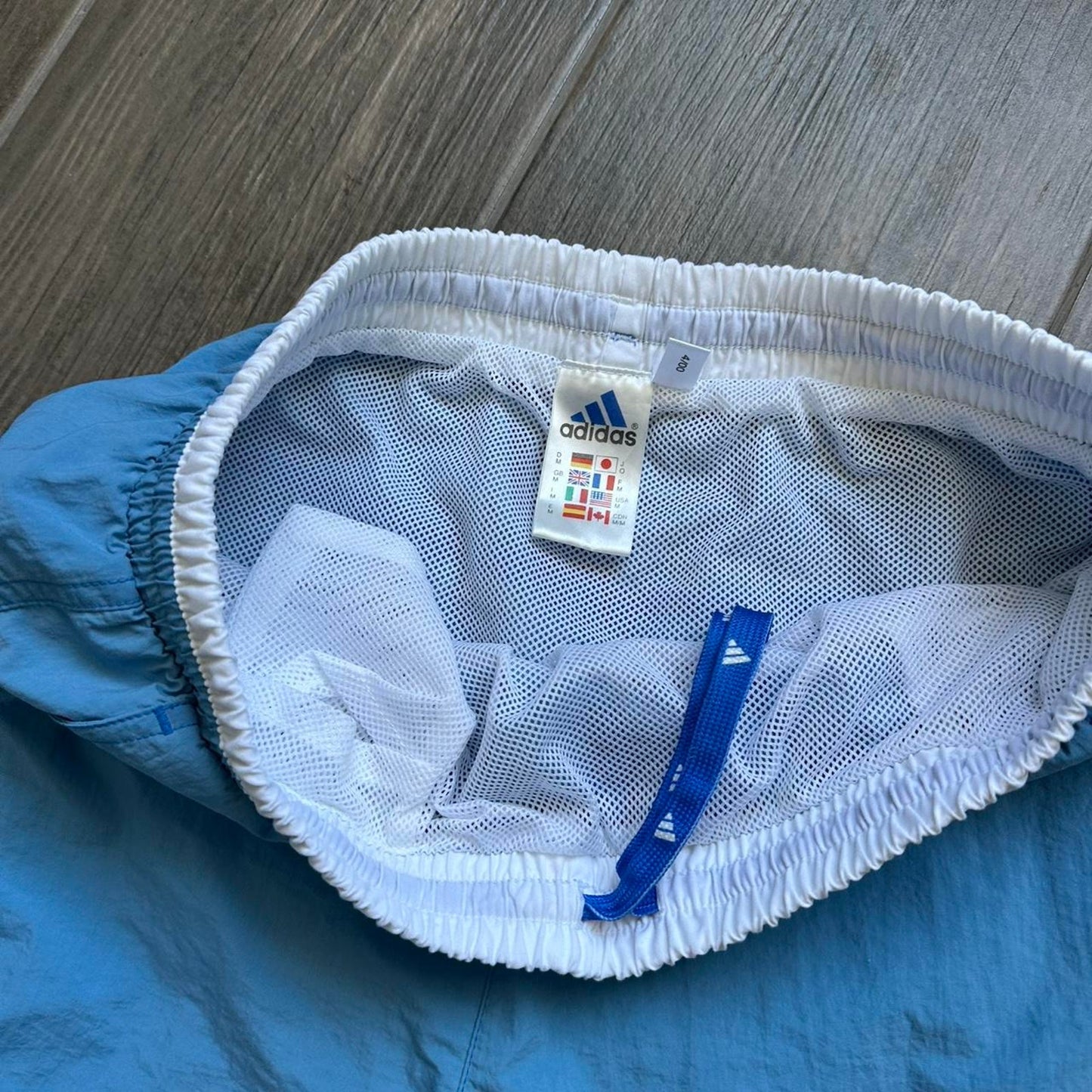 Adidas blue shorts with white