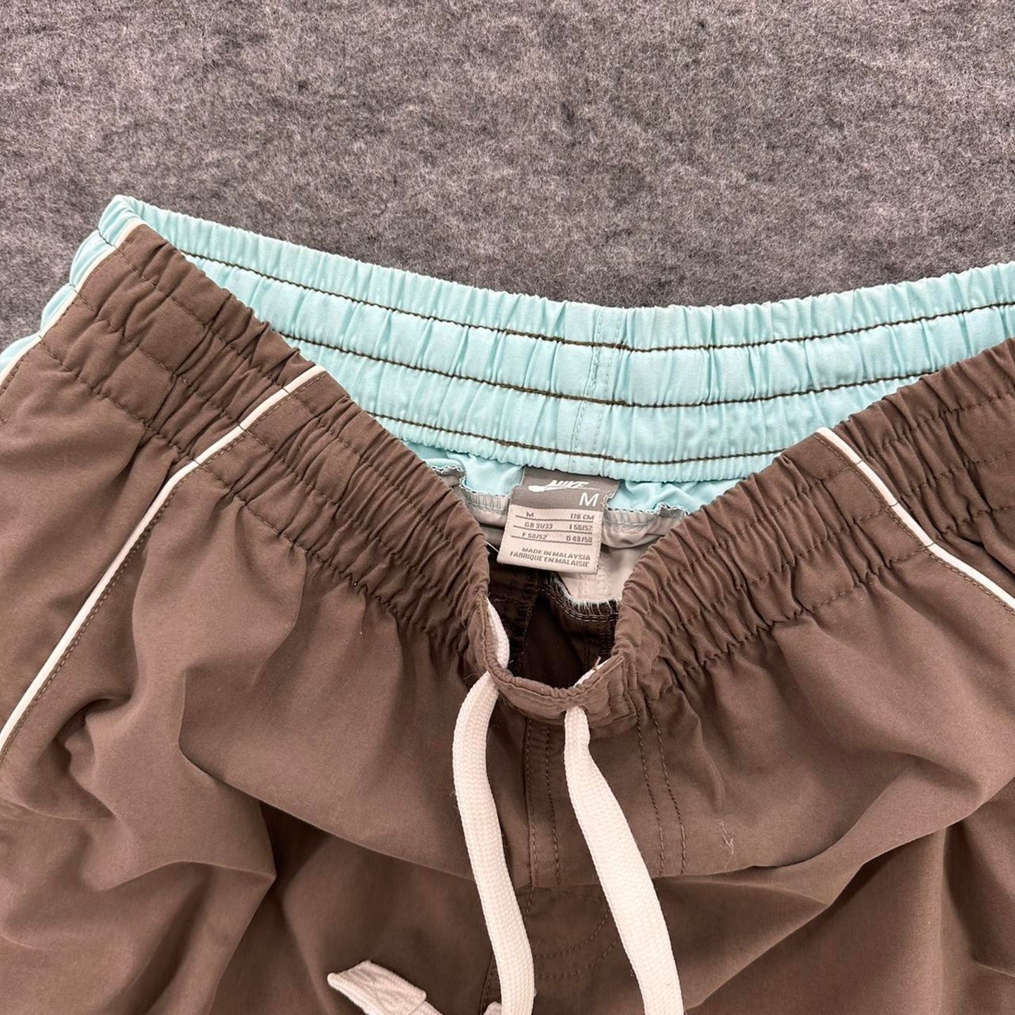 Nike brown shorts with light
