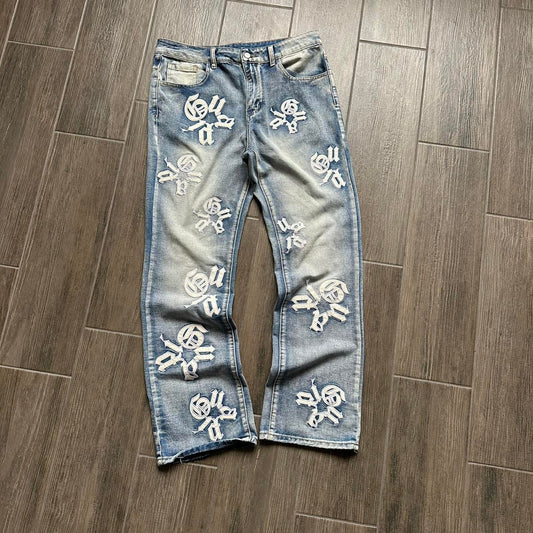 Distressed blue denim jeans with