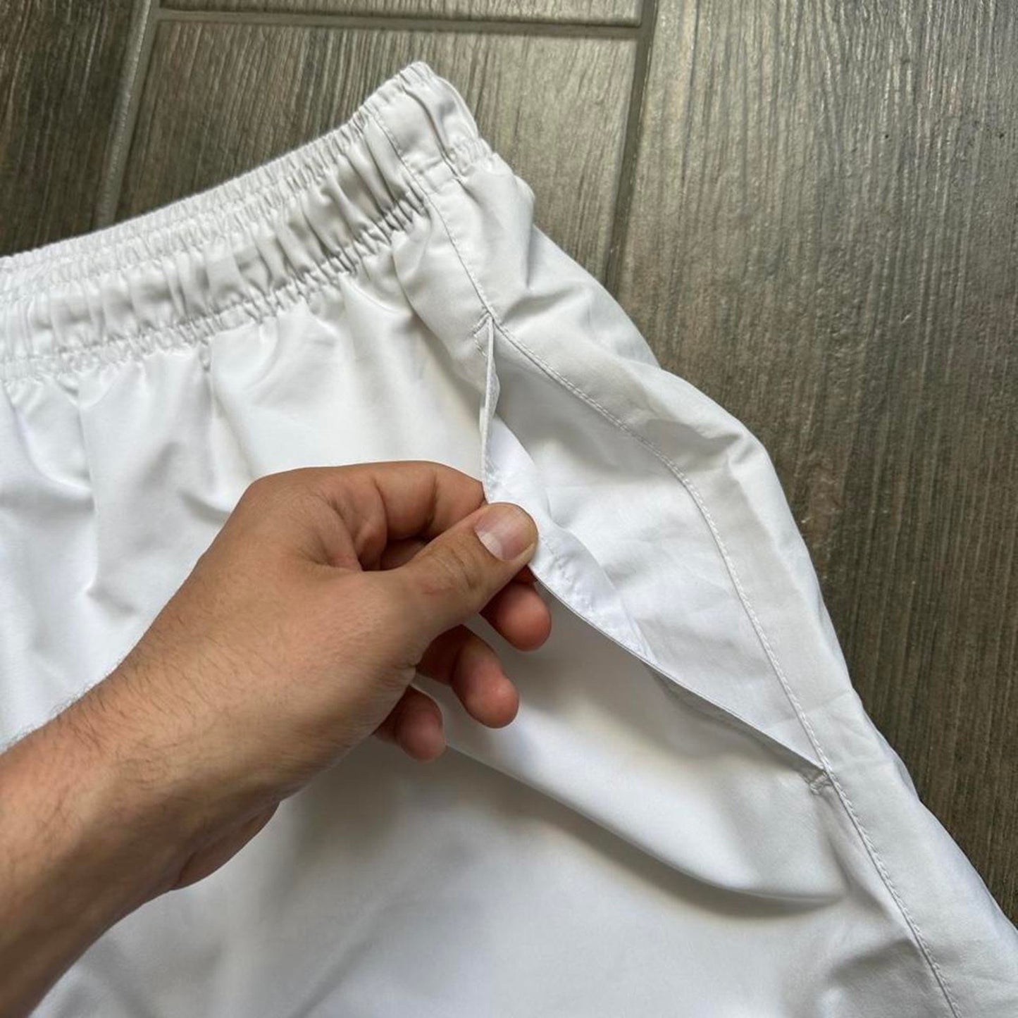 Nike white shorts with black swoosh