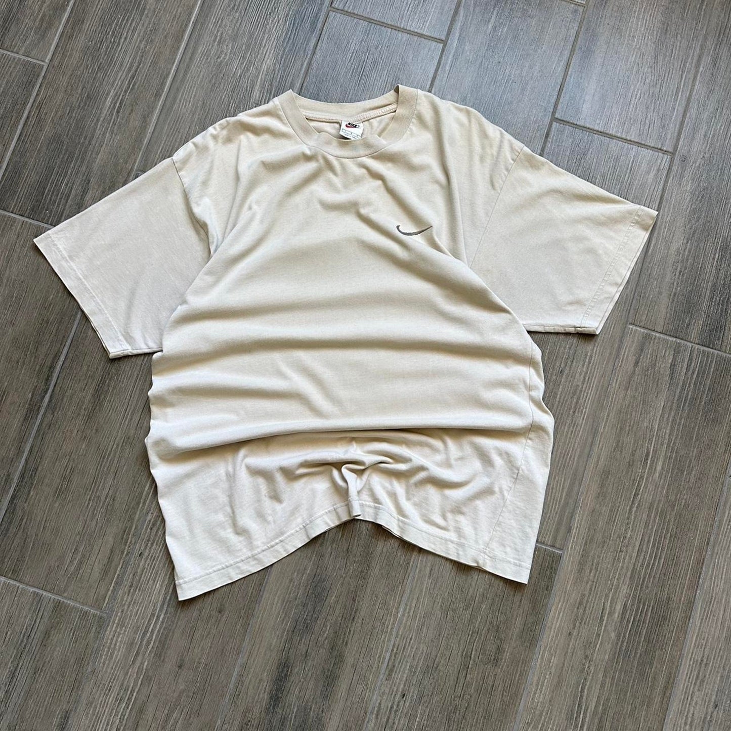 Cream Nike tee with embroidered swoosh
