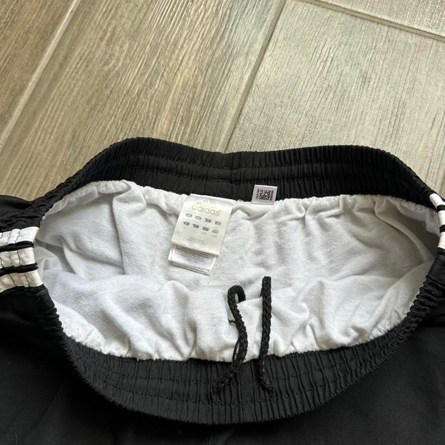 Adidas black shorts with white stripes