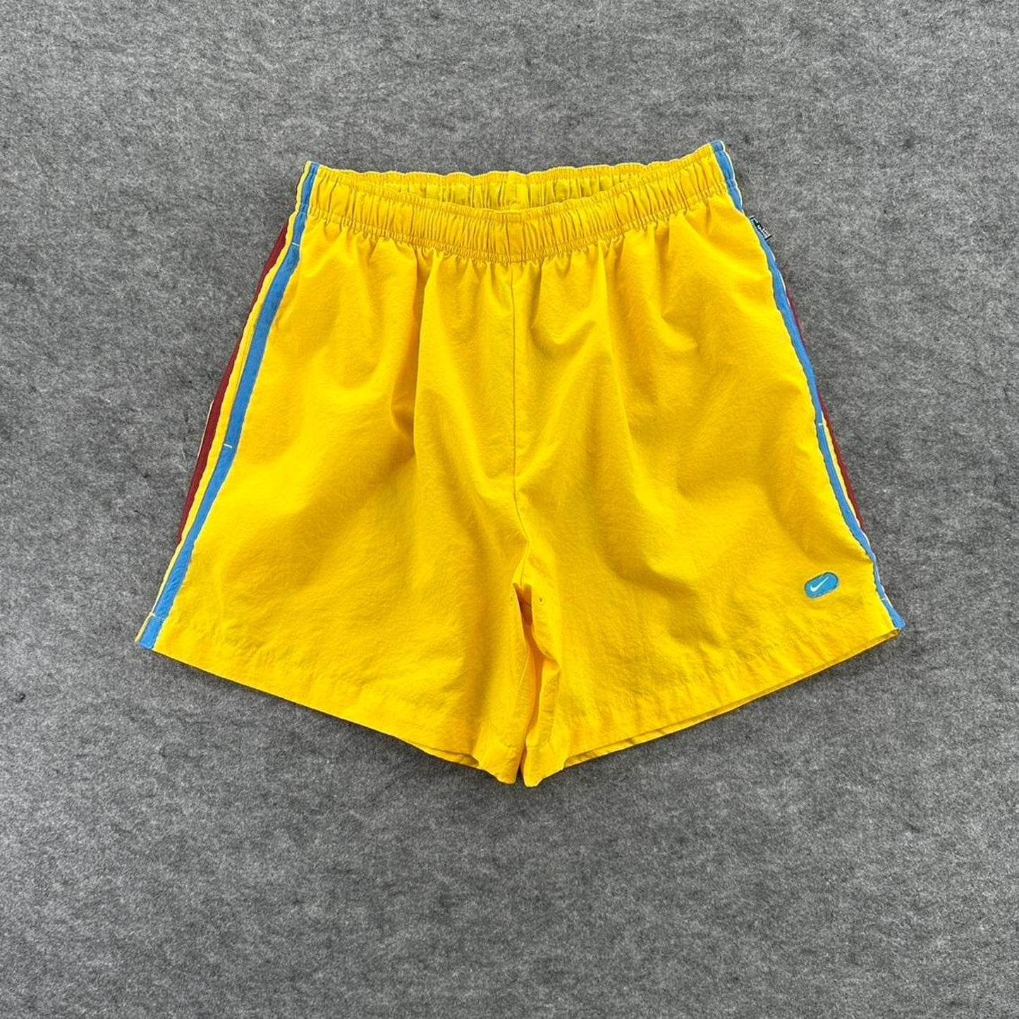 Nike yellow track shorts