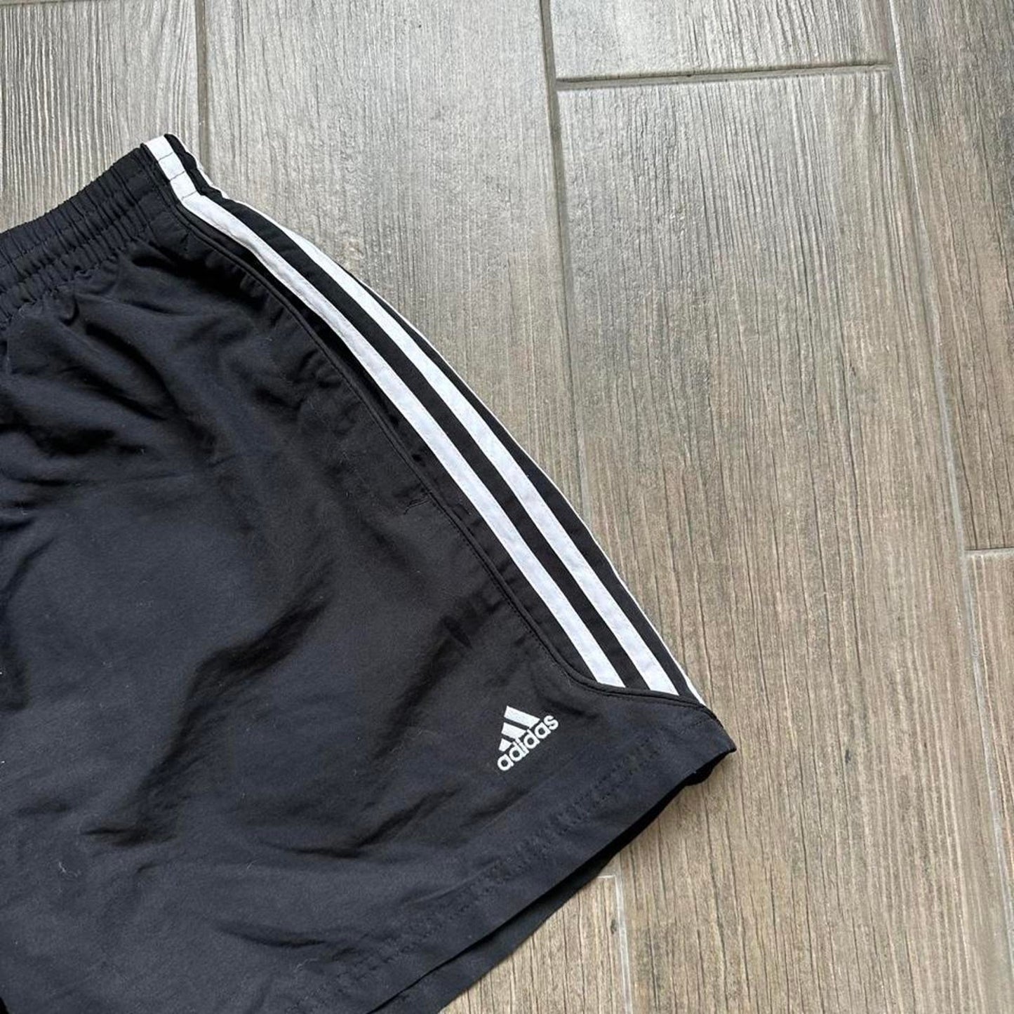 Adidas black shorts with white stripes