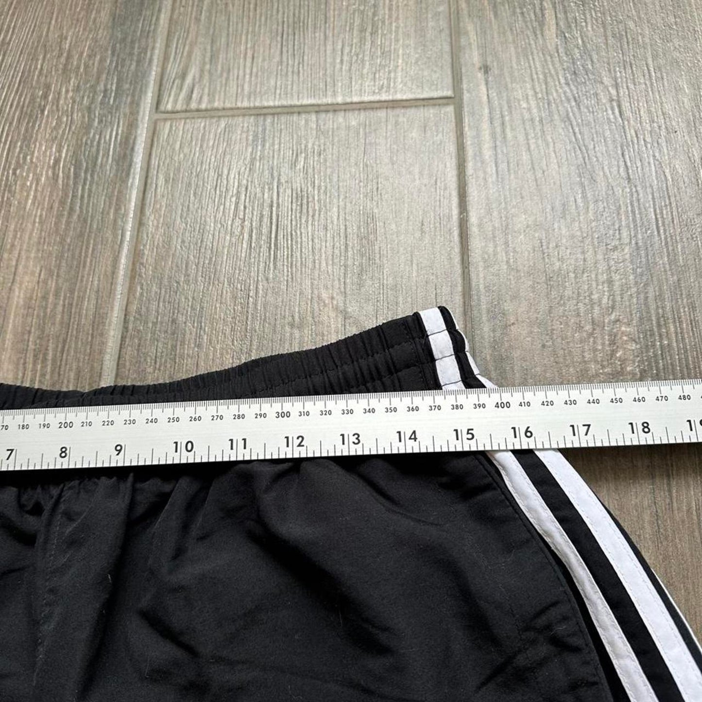 Adidas black shorts with white stripes