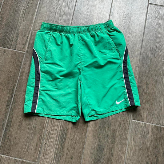 Nike green shorts with white and black stripes