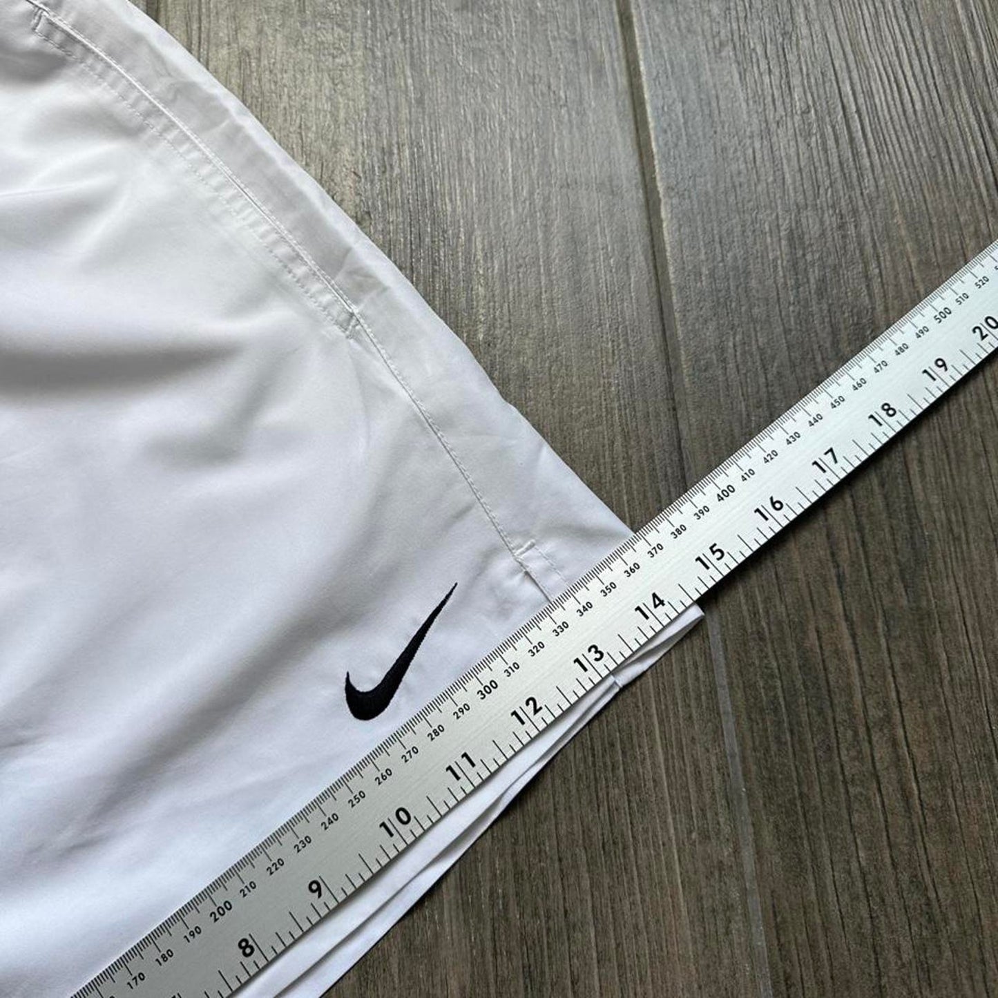 Nike white shorts with black swoosh