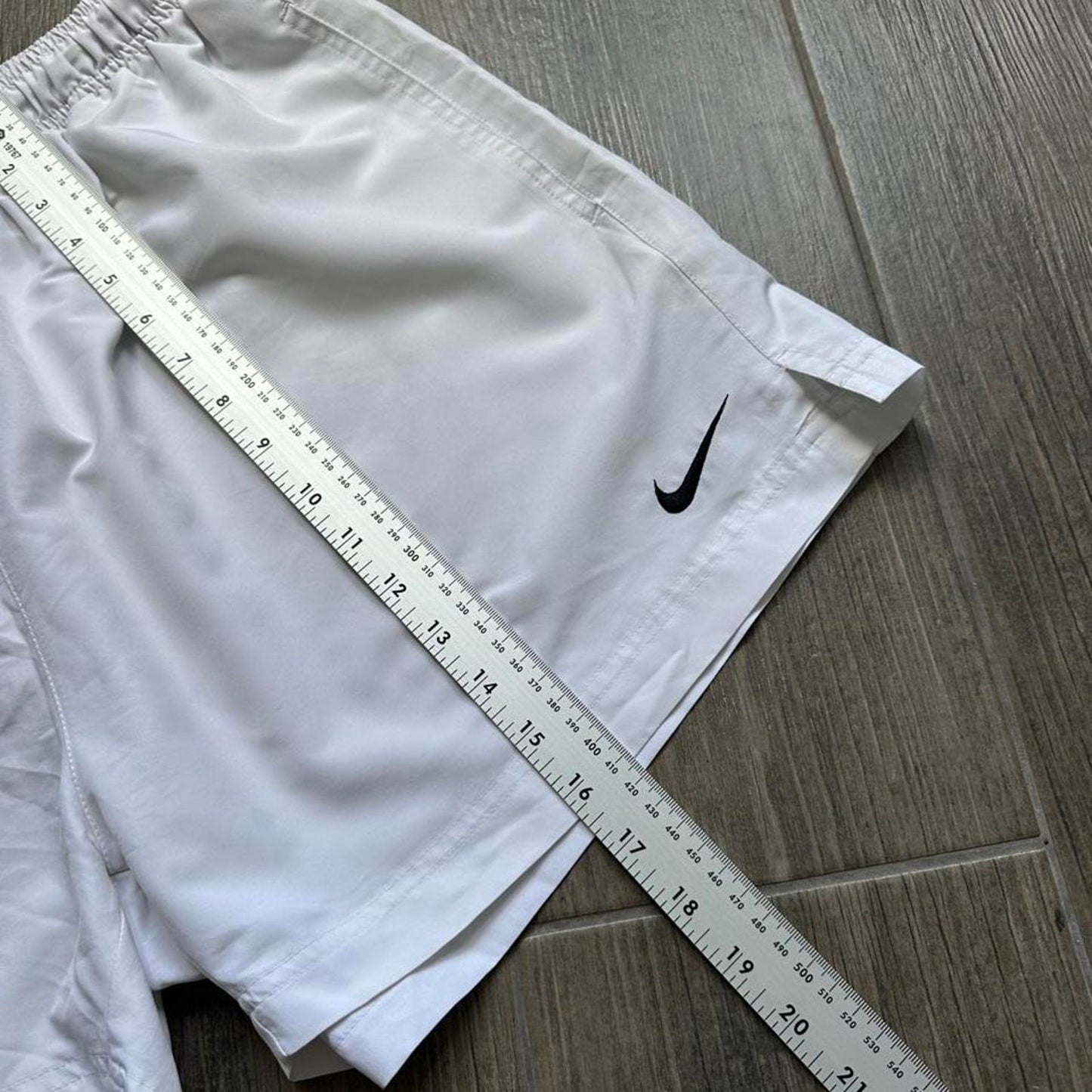 Nike white shorts with black swoosh