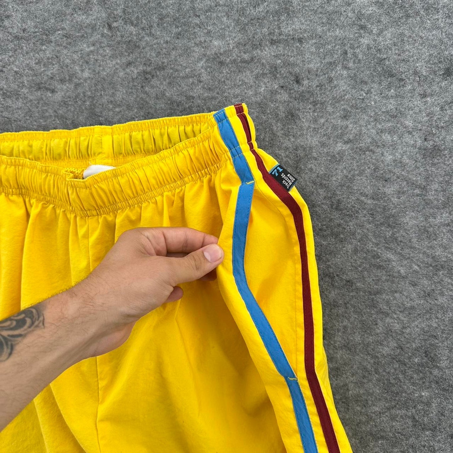 Nike yellow track shorts