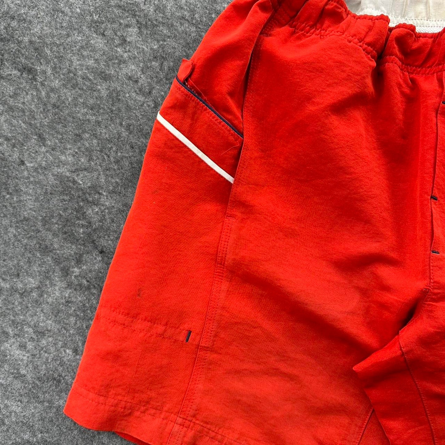 Nike red shorts with white